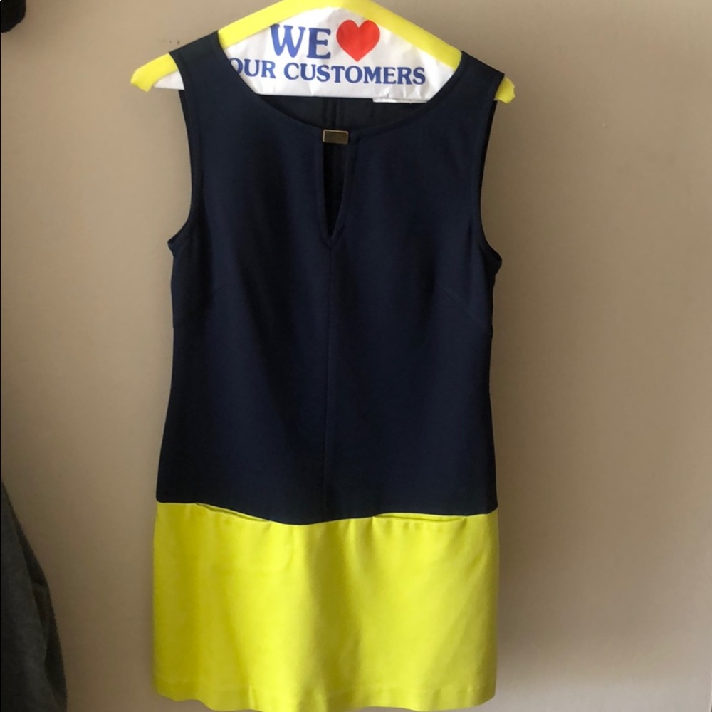 Trina Turk sleeveless dress with front pockets